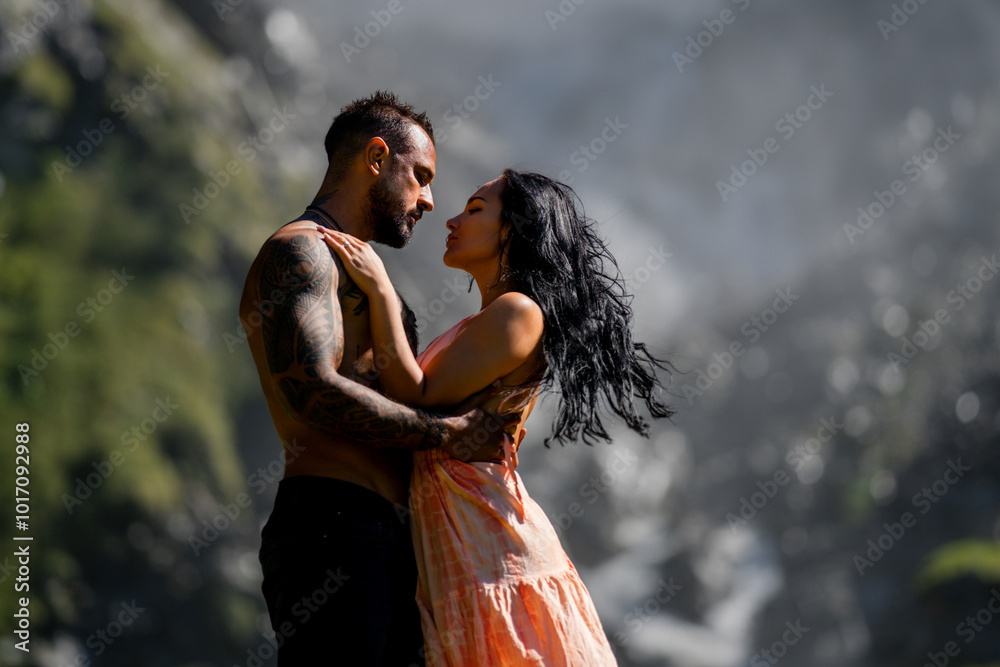 Sexy couple kissing on nature. Couple in erotic pose. Sexy models