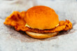 © Andrew Kornylak - A fried fish fillet sandwich on white parchment paper