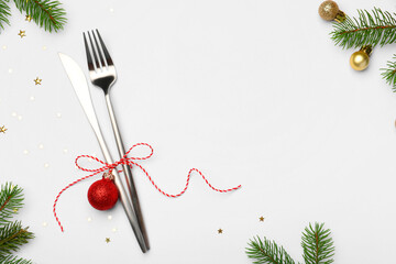 Canvas Print - Christmas table setting. Cutlery and festive decor on white background, flat lay. Space for text