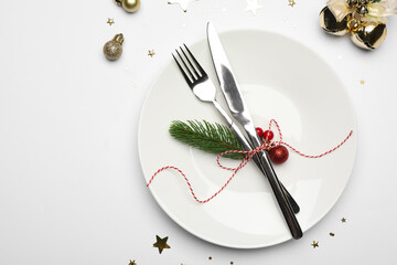 Sticker - Christmas table setting with plate, cutlery and festive decor on white background, flat lay