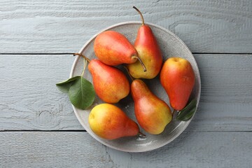 Wall Mural - Ripe juicy pears on grey wooden table, top view