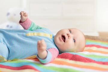 Wall Mural - little baby on white bed