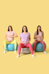 Wall Mural - Beautiful young sporty pregnant women with fitness balls practicing yoga on yellow background