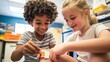 © Sasint - A child pretending to be a school nurse, applying a band-aid to another child's scraped knee,