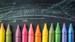 © Katarina - A vibrant array of colorful crayons is neatly arranged in line, set against a blackboard with blue chalk scribbles, symbolizing creativity and childhood imagination.
