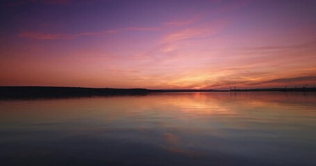 Wall Mural - scenic color sunset over sea water video, beautiful ocean sunrise
