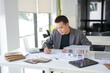 © Charlie's - Architecture Man drawing on architectural Creative project business architecture building construction Industrial engineering Achievement Planning Design on eco blueprint