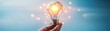 © ZeNDaY - Glowing Light Bulb in Hand,  Symbol of Ideas and Innovation