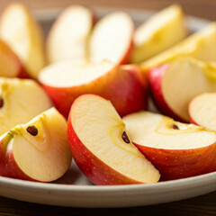 Wall Mural - red apple on a plate. close up of slice of apple in a plate. tasty delicious healthy food slice of apple in plate.