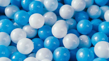 White and blue plastic balls selected for a ball pit