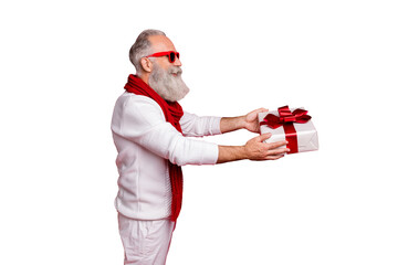 Wall Mural - Aged hipster man giving big giftbox to grandchild wear sun specs knitted jumper isolated red background