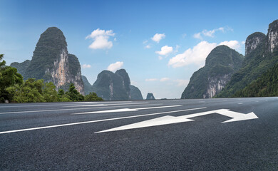 Serene Road Leading Through Majestic Mountain Landscape