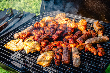 grilled meat over the coals on barbecue