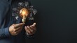 © Arty&Happy - Woman’s hand holding a glowing lightbulb, symbolizing innovation and creativity in business