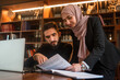 © Malik Nalik - Business team of young man and Muslim woman working together on the project planning strategy in the modern office, business consultant meeting is discussing financial situation Finance and Accounting
