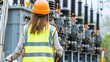 © Chen - A worker in a reflective vest and hard hat stands in front of a large electrical transformer, inspecting the transformer with a focused expression. repair,maintenance,troubleshoot, AI
