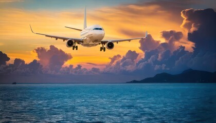 Airplane flying over tropical sea at sunset White passenger plane flying in the sky 