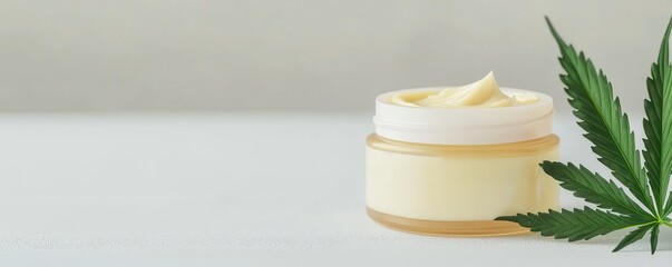 Wall Mural - A CBD cream container sits elegantly on a clean white table, offering a minimalist backdrop.