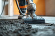 © Vovmar - A worker removes construction dust in a new apartment using a powerful vacuum cleaner. Generated by artificial intelligence