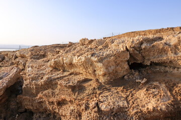 Ecological catastrophe of the Dead Sea. Erosion and salt formations on the surface of the earth. Jordan