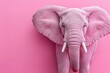 © Nataliia_Trushchenko - Pink elephant is standing in front of a pink background. The elephant has a pink trunk and pink ears. Vibrant pink elephant against a pink background