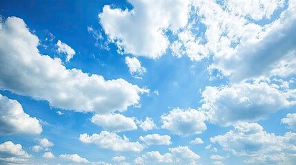 Wall Mural - a shining blue sky with fluffy white clouds, creating a bright, calm, and serene view, perfect for a