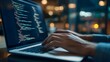 © plaksa - Hands typing on laptop with programming code on screen, representing software development. Perfect for coding, IT solutions, digital technology, web applications.