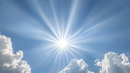 Wall Mural - soft, white clouds floating in a vibrant blue sky, with the sun rays shining through and casting a r