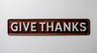 © Erlinda - give thanks lettering on antique rugged rusty metal sign on plain white background