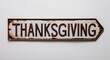 © Erlinda - thanksgiving lettering on antique rugged rusty metal sign on plain white background