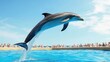 © sujitea - A dolphin performing a high jump out of the water during a marine show, with an audience in the background cheering.
