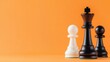 © pprothien - A close-up of chess pieces showcasing strategic gameplay with a vibrant orange background creating a bold and dynamic visual.