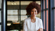 © Monkey Business - Portrait Of Smiling Young Businesswoman Working In Modern Open Plan Office