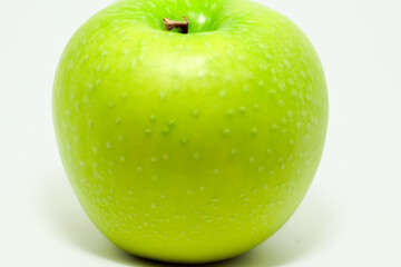 A white with s and greens. Fresh healthy food concept. Close up of a fruit with greens and s on white. Close up of a fruit in a of greens and whites lifestyle.