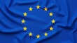 © PLATİNUM - European Union Flag Waving Gently Against a Blue Background Highlighting Its Stars and Symbolism
