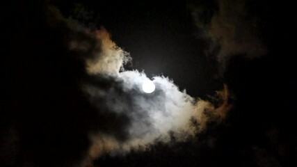 Wall Mural - moon and clouds Partial lunar eclipse Full moon and lunar eclipse Full moon between the clouds Super moon 2024