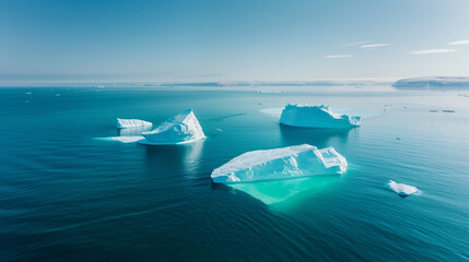 Aerial view of large chunks of ice floating in the middle of the sea, global warming issue.