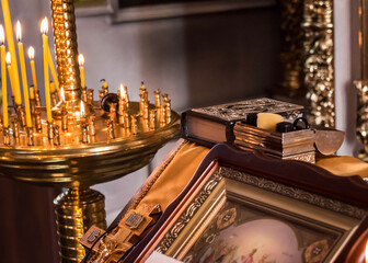 Interior of the Orthodox Church, candles and candlesticks.