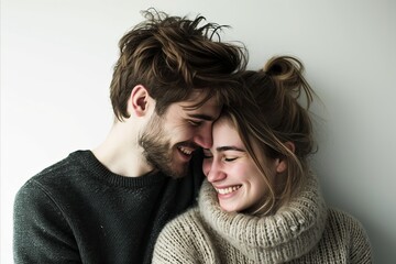 Poster - Young couple in love. Handsome man and beautiful woman in sweaters on white background