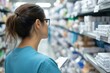 © ImagePulse - Logistics manager reviewing medical supply inventory in a hospital warehouse, photorealistic healthcare logistics scene