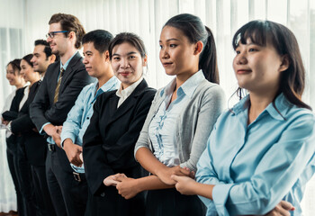 Modern diversity and multicultural company, business people joining hand together and standing in line, shared commitment to collaboration and cooperation concept background. Meticulous