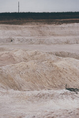 Piles of salt in a quarry in the evening. Toned.