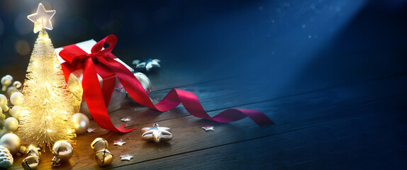 Wall Mural - christmas background with christmas tree decoration and christmas gifts on a wooden table. greeting 