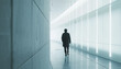 © Qstock - Modern Minimalistic Corridor with Silhouette of a Man Walking - Futuristic Design and Ambient Lighting
