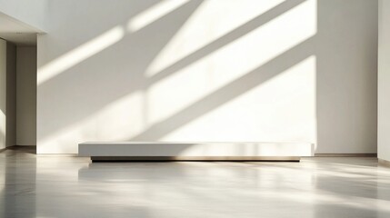 Poster - Bright natural light streams through a large window, creating long shadows that enhance the simplicity of the design. The space features a sleek white bench against a pristine wall