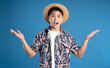 © STOCK88PHOTOGRAPHER - Portrait of Asian man wearing summer clothes posing on blue background