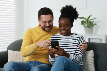 Canvas Print - International relationships. Lovely couple spending time together at home