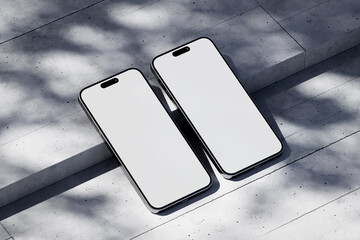 Wall Mural - Two phones with a blank screen on a concrete background