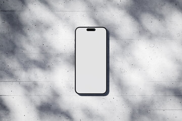 Wall Mural - Phone with a blank screen on a concrete background