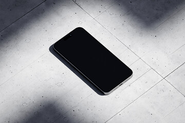 Wall Mural - Phone with a blank screen on a concrete background